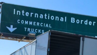 Highway sign for international border commercial trucks lane