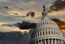 Capitol dome under dark dramatic storm clouds