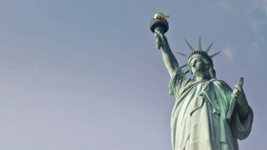 Statue of Liberty torch and crown against sky