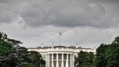 White House south front beneath dark overcast sky