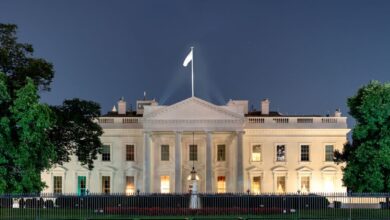 White House north front at night behind fence